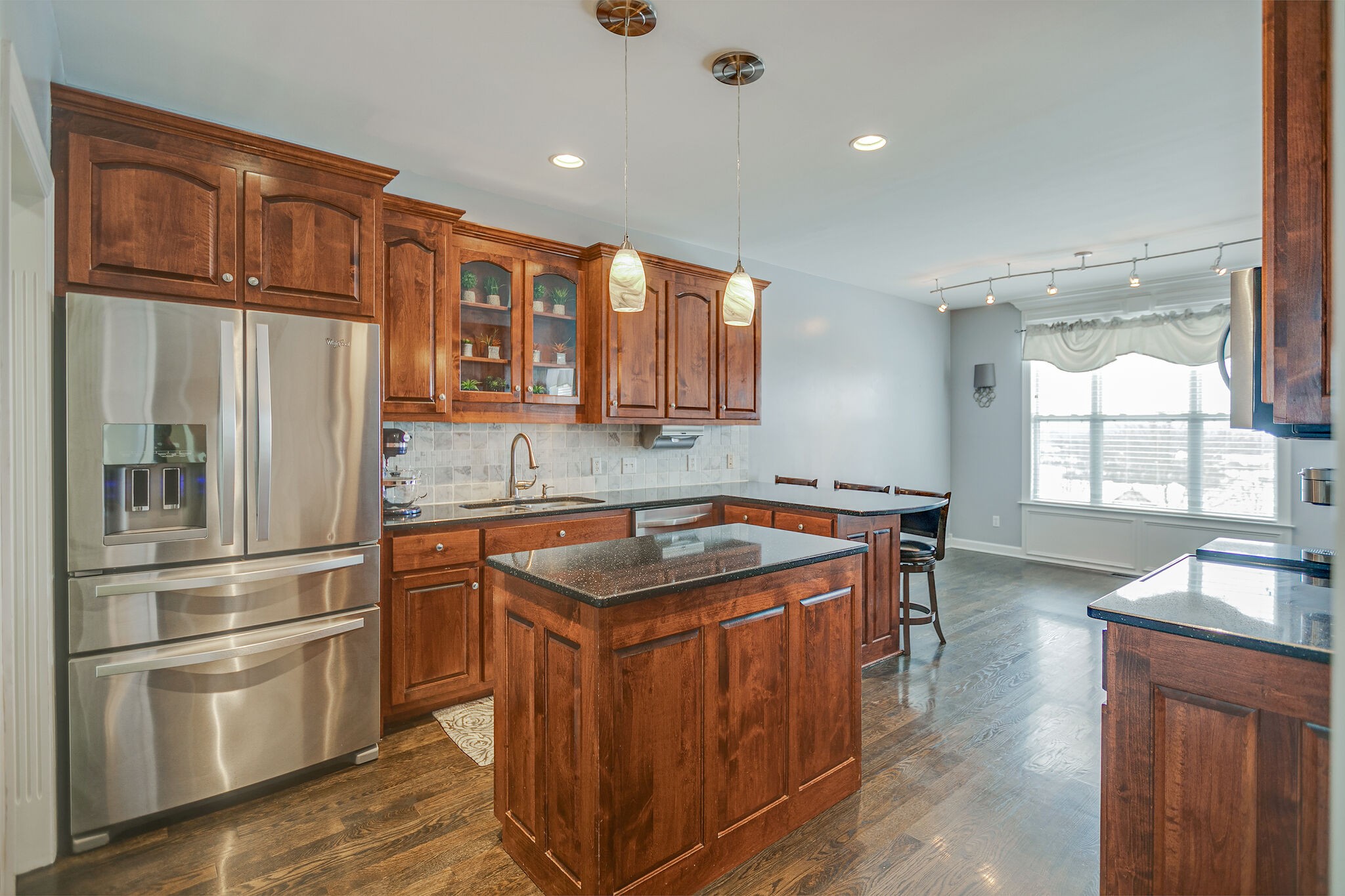 3029 Viewpointe Way Columbia, TN 38401 - Photo 12 of 40 a kitchen with stainless steel appliances granite countertop a refrigerator a sink a stove and a wooden floors