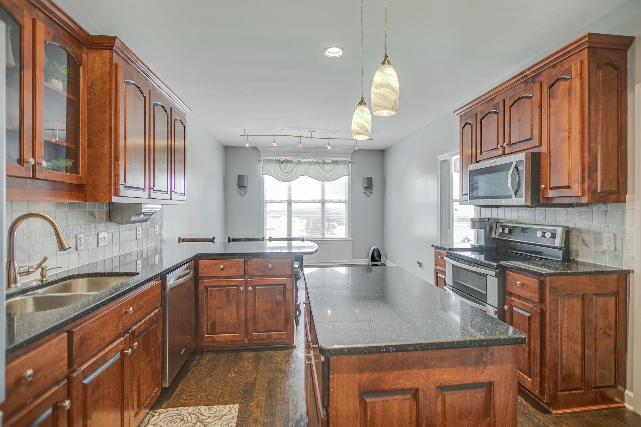 3029 Viewpointe Way Columbia, TN 38401 - Photo 13 of 40 a kitchen with stainless steel appliances granite countertop a sink stove and cabinets