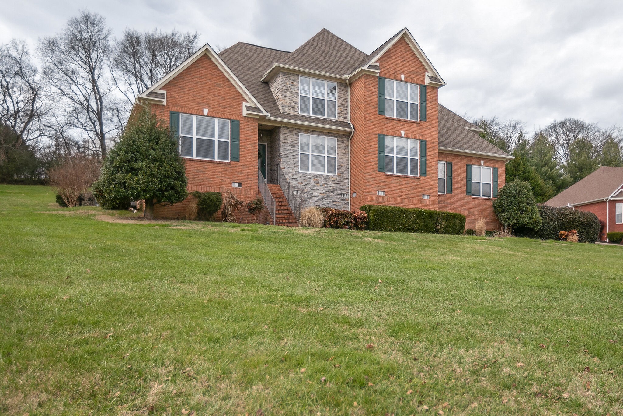 3029 Viewpointe Way Columbia, TN 38401 - Photo 2 of 40 a front view of a house with a yard and trees