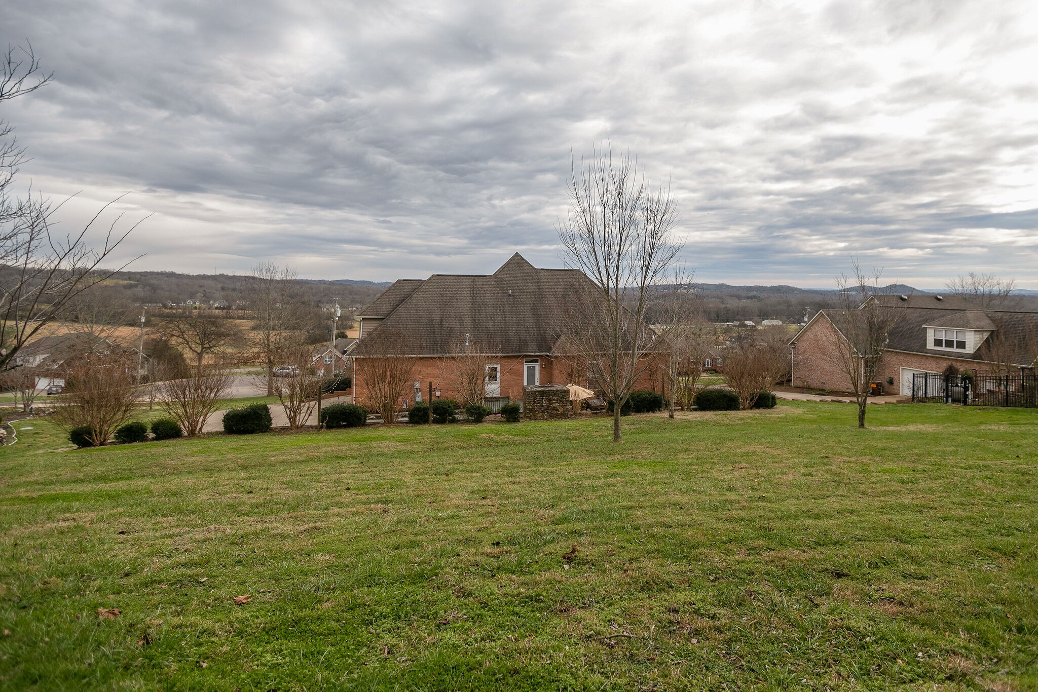 3029 Viewpointe Way Columbia, TN 38401 - Photo 35 of 40 a view of a big house with a big yard and large trees