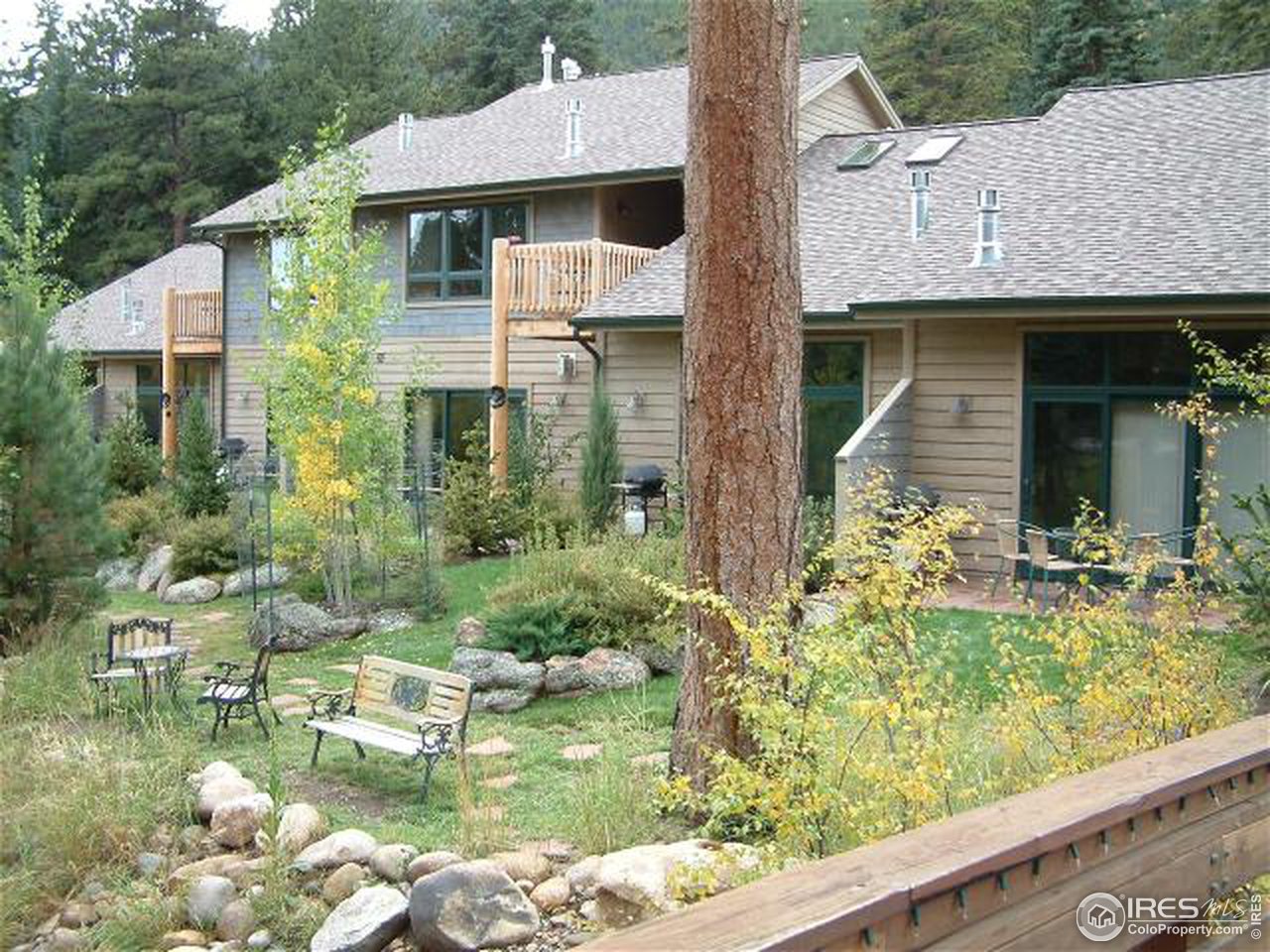 a aerial view of a house with swimming pool and a yard