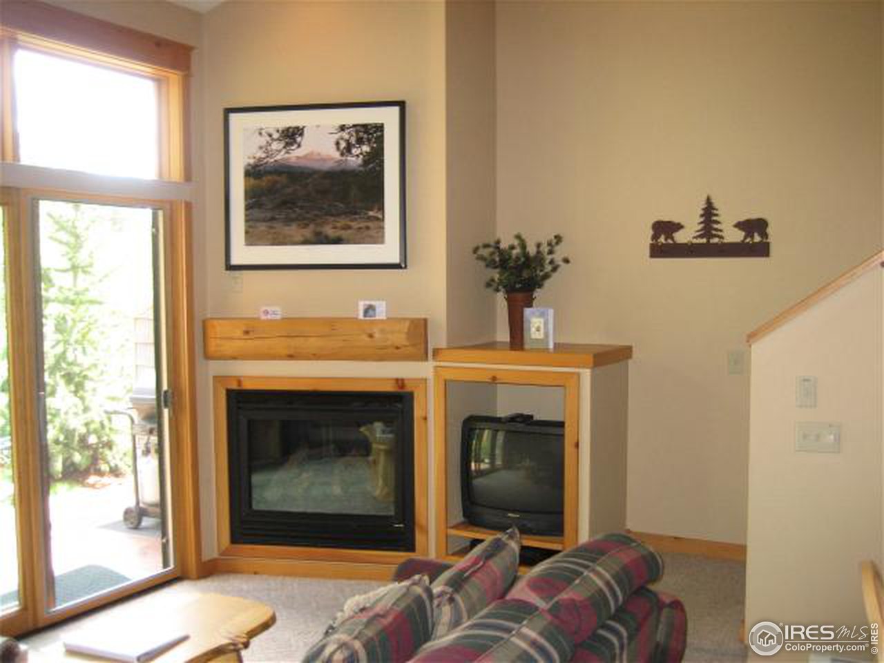 2100 Fall River Road, Unit 6 Estes Park, CO 80517 - Photo 2 of 6 a living room with furniture and a fireplace