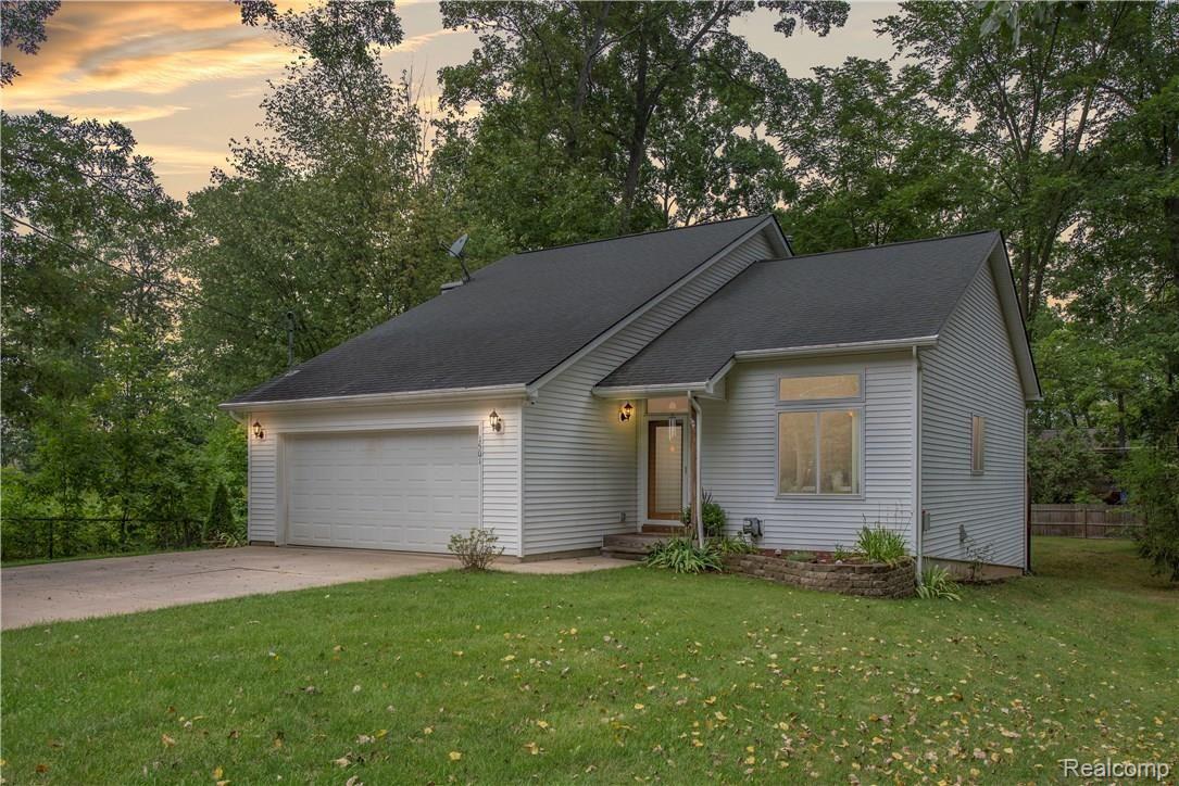 1501 Remsing Street Hartland, MI 48353 - Photo 1 of 29 Front of home with mature trees