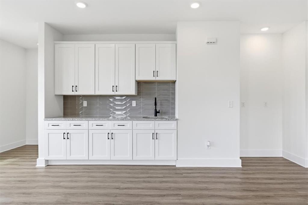 208 Mission Way Atlanta, GA 30315 - Photo 12 of 43 a white kitchen with granite countertop white cabinets