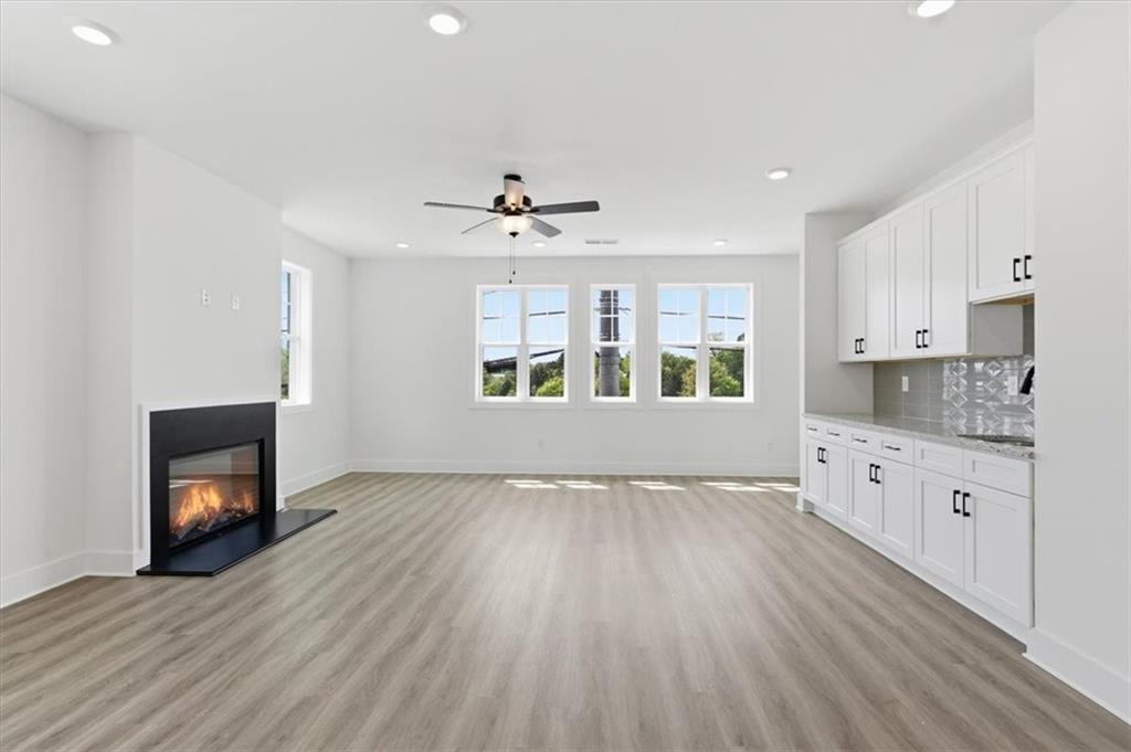 208 Mission Way Atlanta, GA 30315 - Photo 15 of 43 a view of an empty room with a fireplace and a window