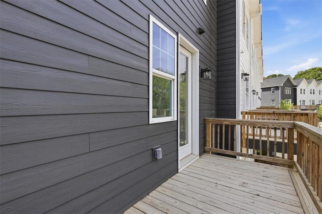 208 Mission Way Atlanta, GA 30315 - Photo 17 of 43 a view of a brick house with a wooden deck