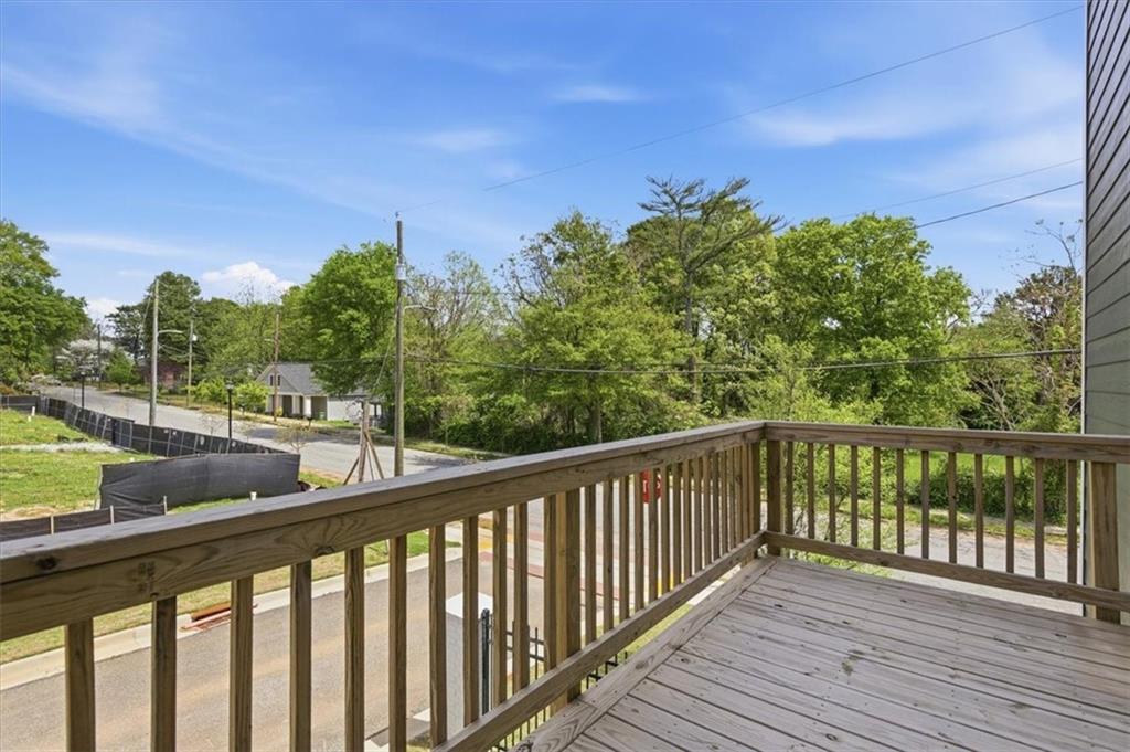208 Mission Way Atlanta, GA 30315 - Photo 18 of 43 a view of a balcony with wooden fence and floor