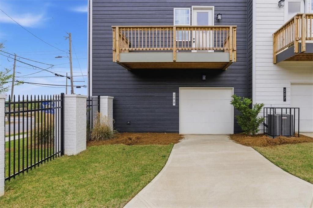 208 Mission Way Atlanta, GA 30315 - Photo 20 of 43 a view of a brick house with a small yard
