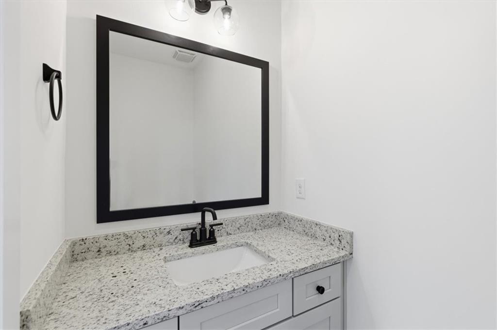 208 Mission Way Atlanta, GA 30315 - Photo 32 of 43 a bathroom with a granite countertop sink and a mirror
