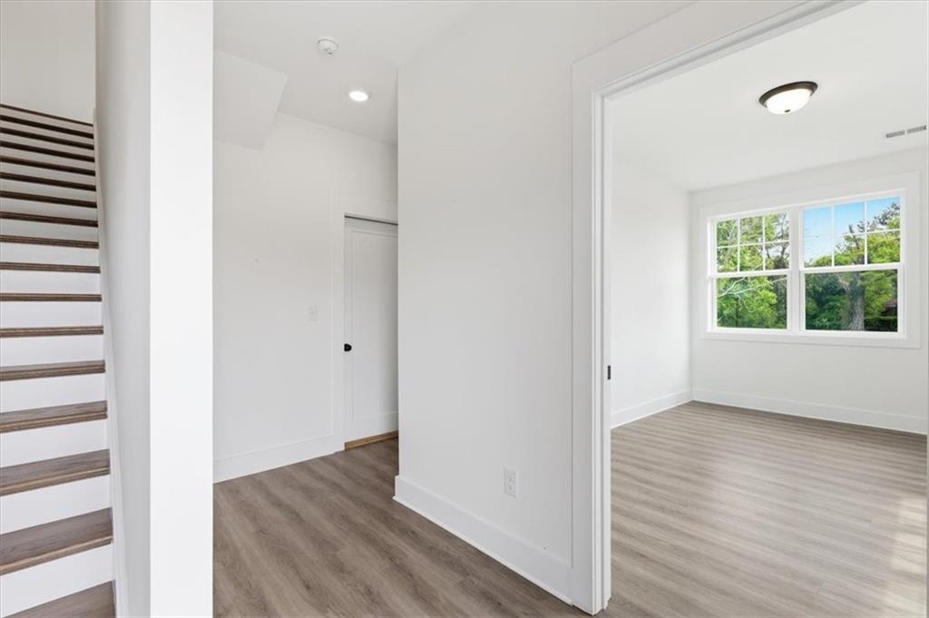 208 Mission Way Atlanta, GA 30315 - Photo 40 of 43 a view of an empty room with wooden floor and a window
