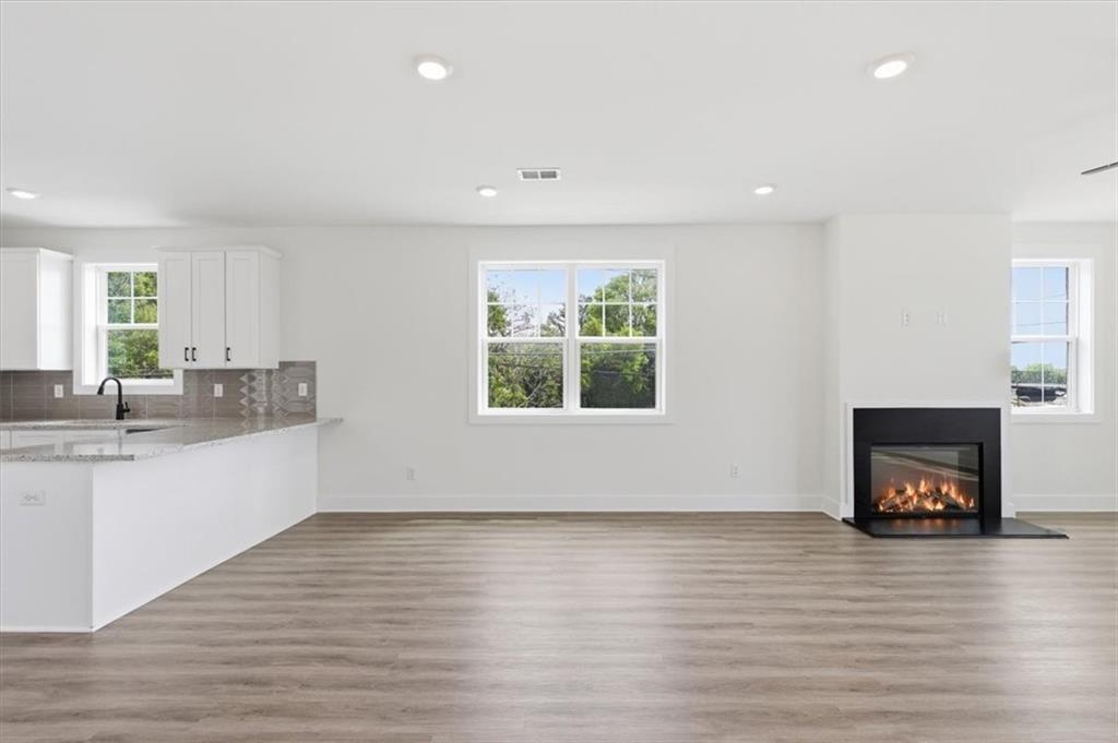 208 Mission Way Atlanta, GA 30315 - Photo 4 of 43 a view of kitchen and hall with wooden floor