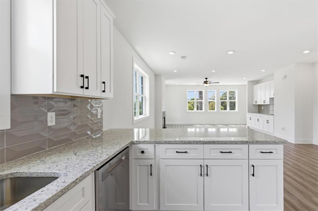 208 Mission Way Atlanta, GA 30315 - Photo 9 of 43 a kitchen with granite countertop white cabinets and a sink