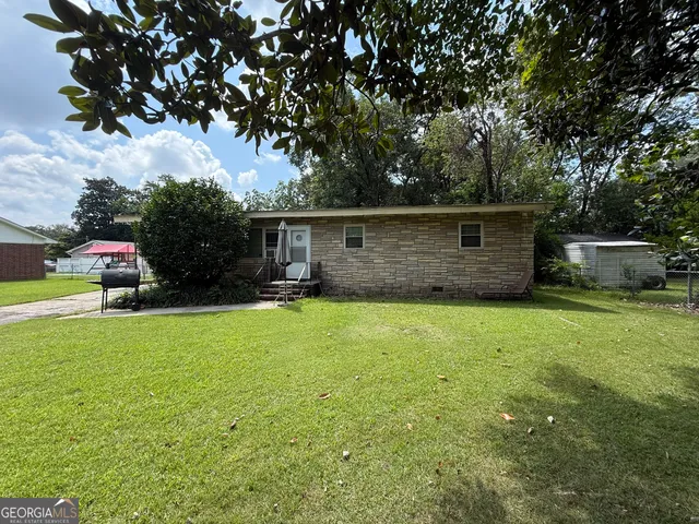 a view of a backyard with a garden