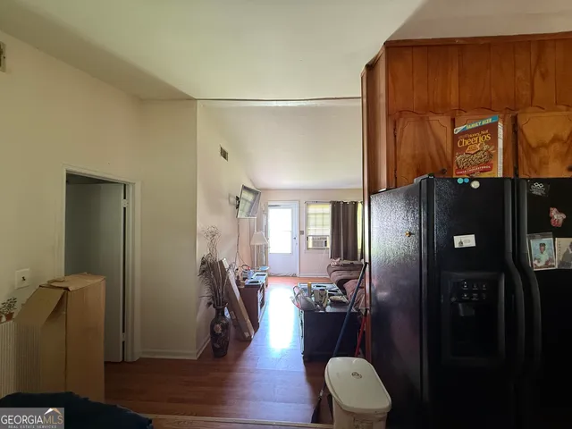 a view of a hallway with seating area