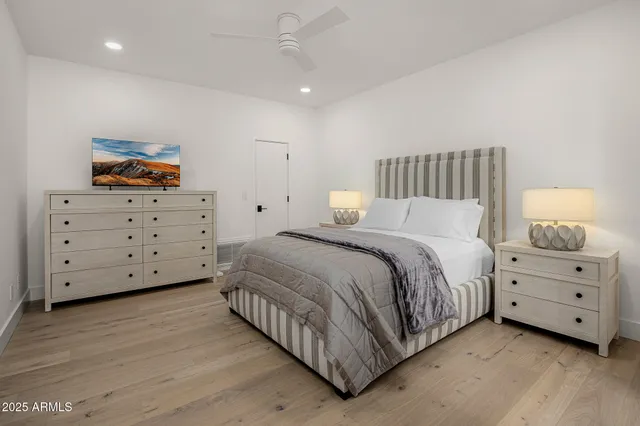 a bedroom with a bed and a dresser