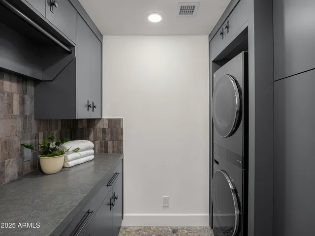 a kitchen with a microwave and a sink