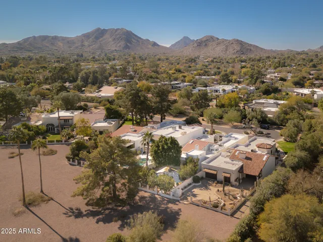 an aerial view of residential house and green space