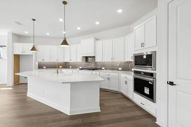 a view of kitchen with wooden floor