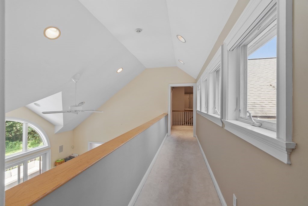 84 Monument Farm Road Concord, MA 01742 - Photo 17 of 34 a view of a hallway with windows