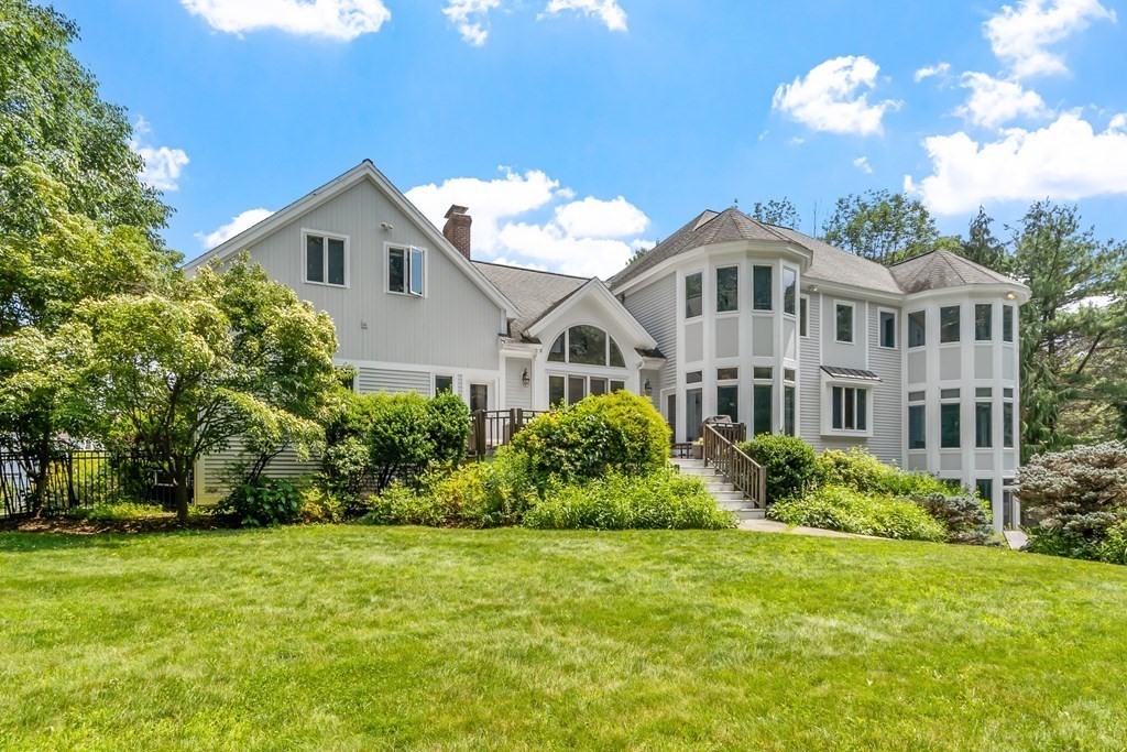 84 Monument Farm Road Concord, MA 01742 - Photo 25 of 34 a front view of a house with a yard