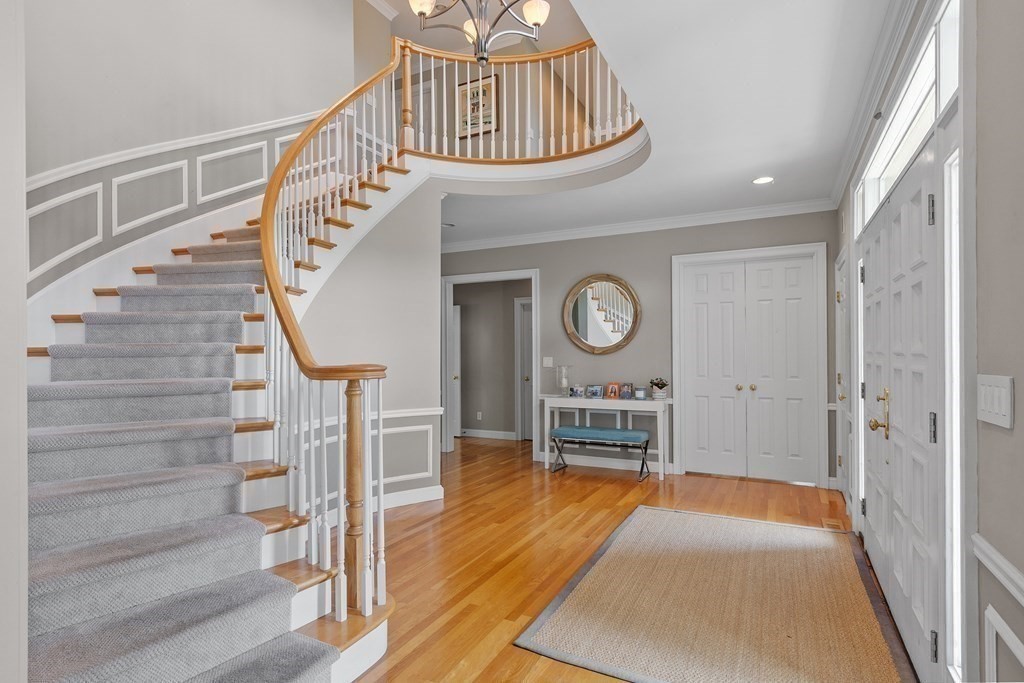 84 Monument Farm Road Concord, MA 01742 - Photo 3 of 34 a view of entryway livingroom and hall with wooden floor