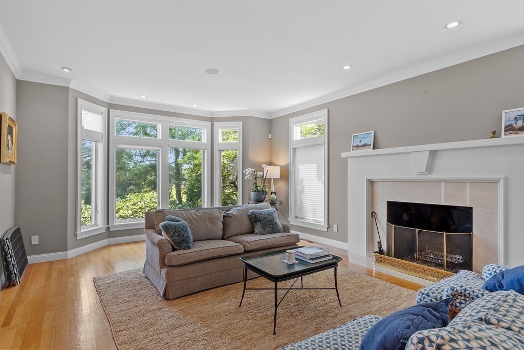 84 Monument Farm Road Concord, MA 01742 - Photo 4 of 34 a living room with furniture and a fireplace