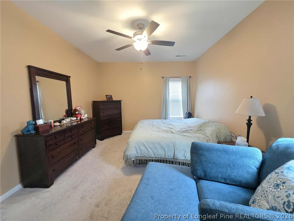 317 Laurel Lake Road Salemburg, NC 28385 - Photo 14 of 29 a living room with furniture and a wooden floor