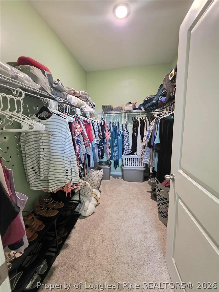 317 Laurel Lake Road Salemburg, NC 28385 - Photo 15 of 29 a view of walk in closet with clothes