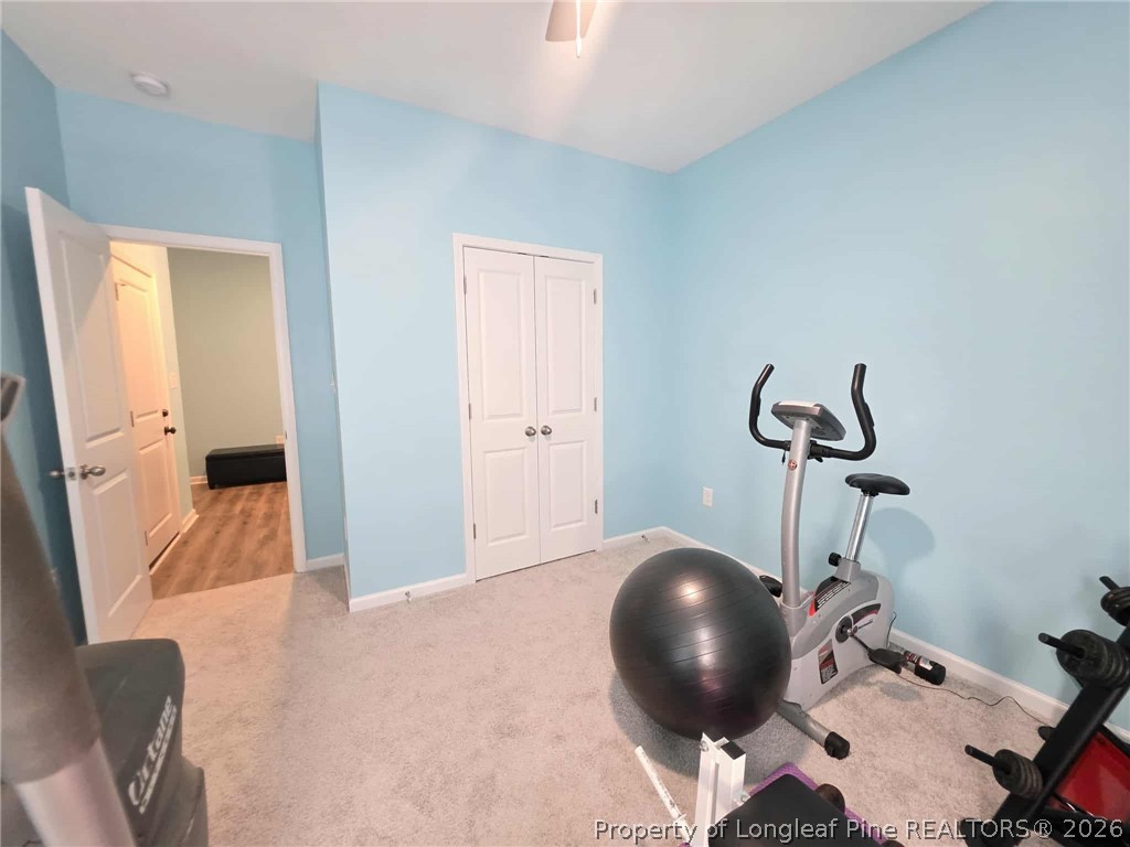 317 Laurel Lake Road Salemburg, NC 28385 - Photo 19 of 29 a bedroom with a bed and cabinets