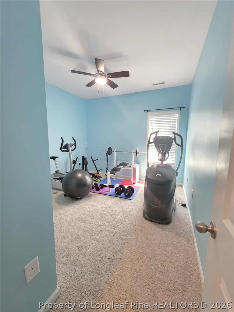 317 Laurel Lake Road Salemburg, NC 28385 - Photo 20 of 29 a living room with furniture and a ceiling fan