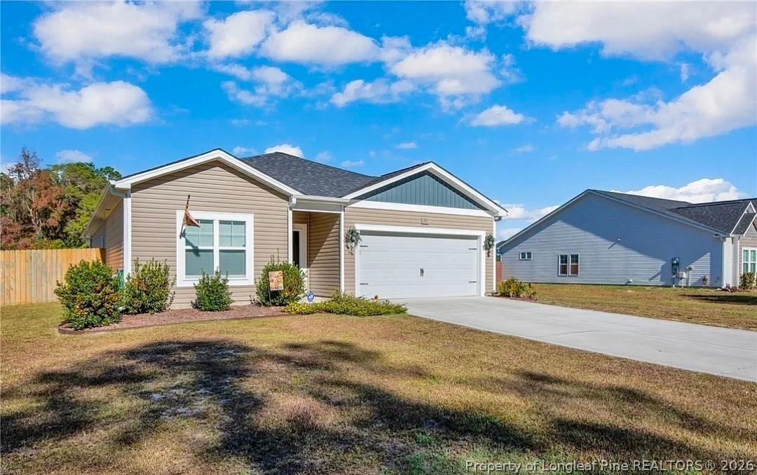 317 Laurel Lake Road Salemburg, NC 28385 - Photo 2 of 29 a front view of a house with a yard