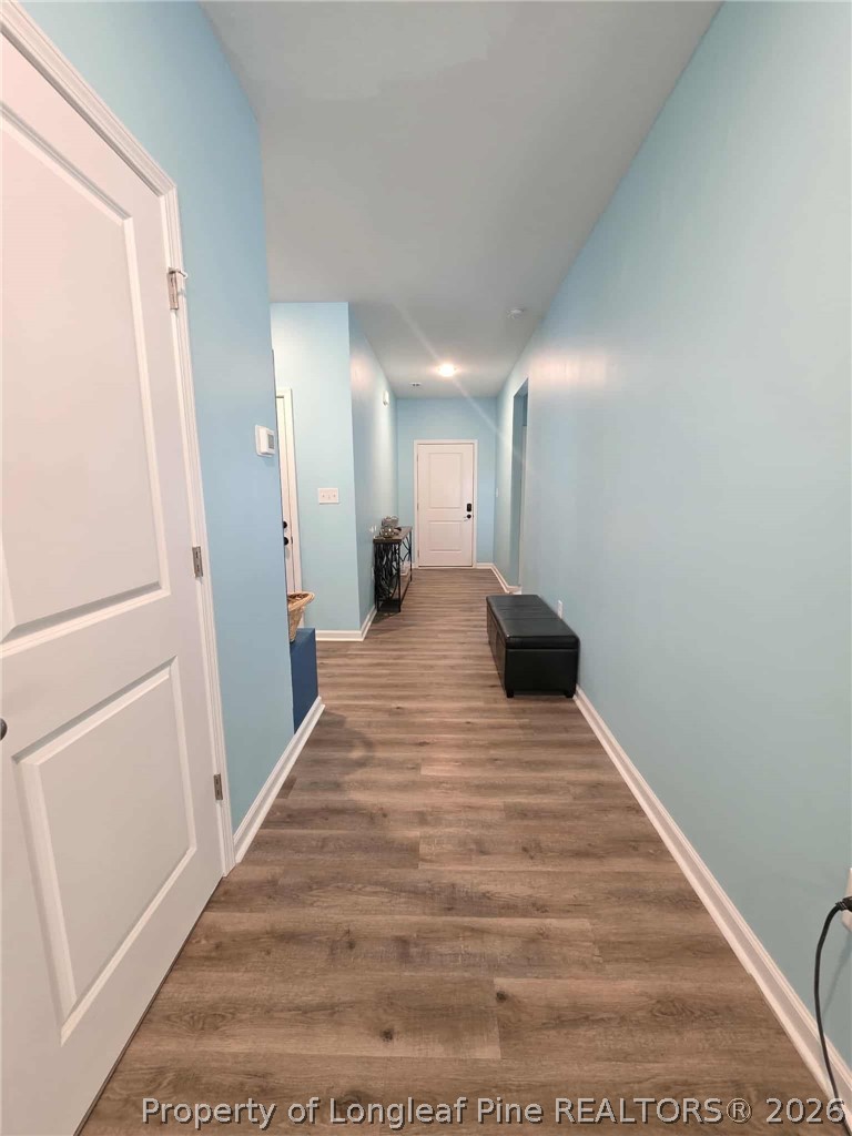 317 Laurel Lake Road Salemburg, NC 28385 - Photo 21 of 29 a view of a hallway with wooden floor and staircase