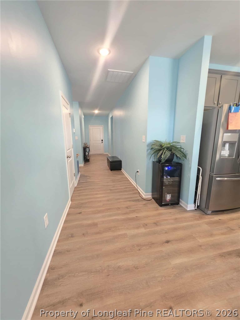 317 Laurel Lake Road Salemburg, NC 28385 - Photo 26 of 29 a view of a hall with wooden floor