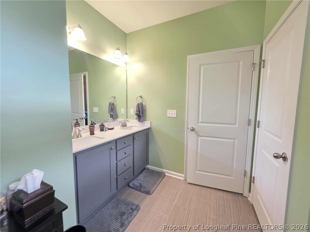 317 Laurel Lake Road Salemburg, NC 28385 - Photo 9 of 29 a bathroom with a sink and a mirror