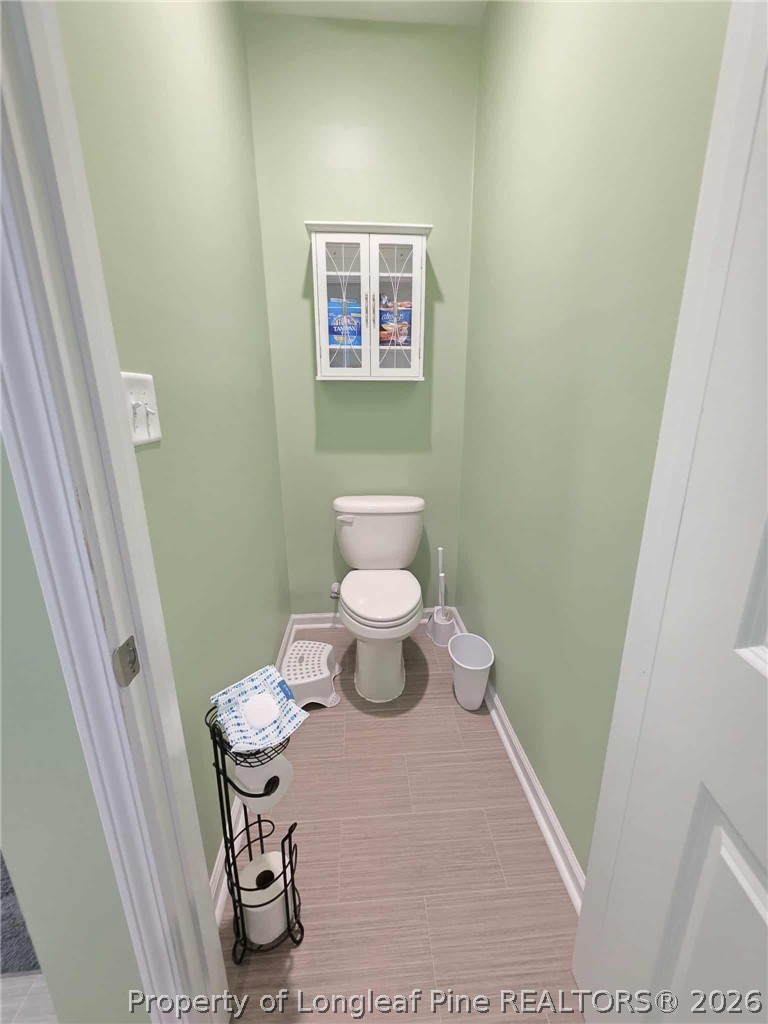 317 Laurel Lake Road Salemburg, NC 28385 - Photo 10 of 29 a bathroom with a sink and a toilet