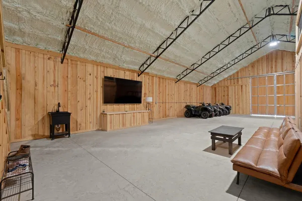 a view of a livingroom with furniture and a flat screen tv