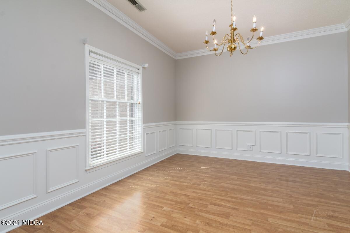 903 Tucker Road Macon, GA 31210 - Photo 13 of 31 a view of an empty room with a window
