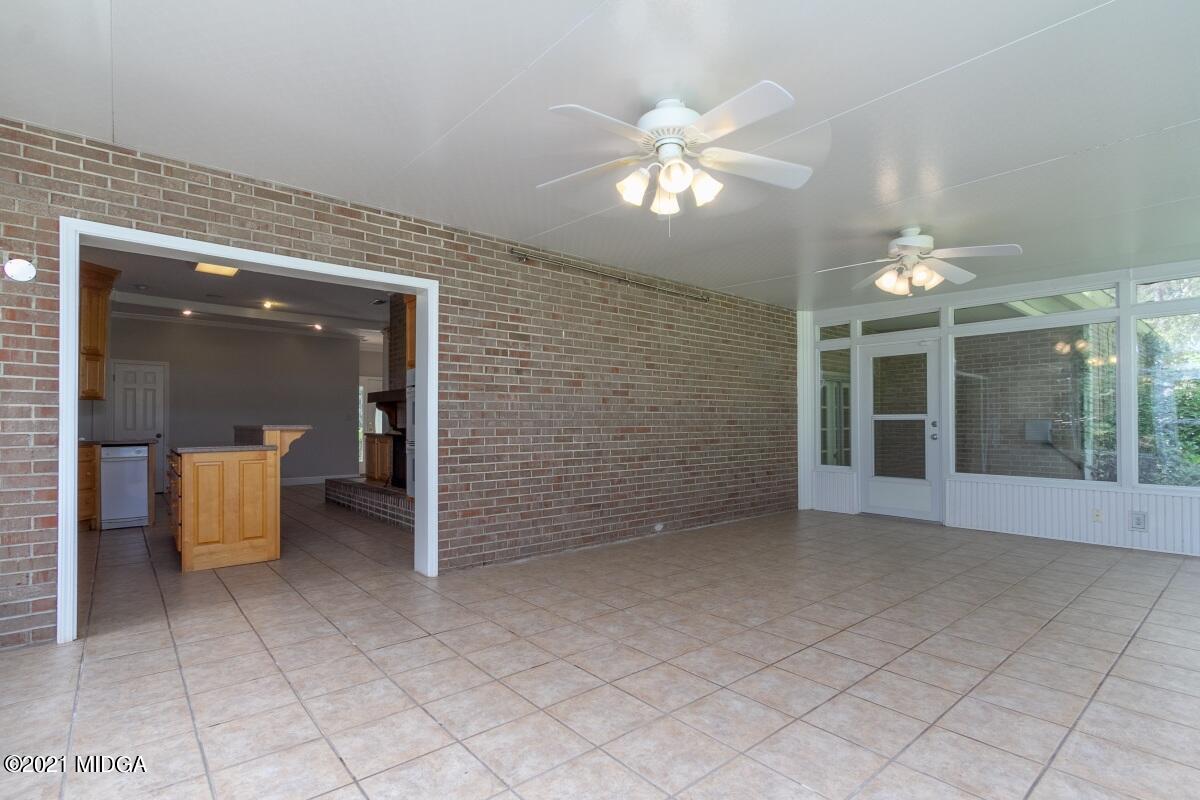 903 Tucker Road Macon, GA 31210 - Photo 23 of 31 a view of a hallway with chandelier and entryway