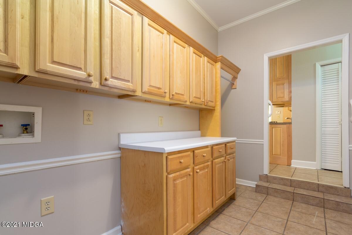 903 Tucker Road Macon, GA 31210 - Photo 24 of 31 a kitchen with stainless steel appliances granite countertop a refrigerator and a stove