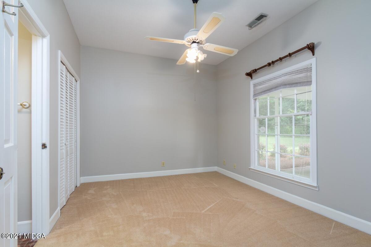 903 Tucker Road Macon, GA 31210 - Photo 27 of 31 a view of an empty room with a window