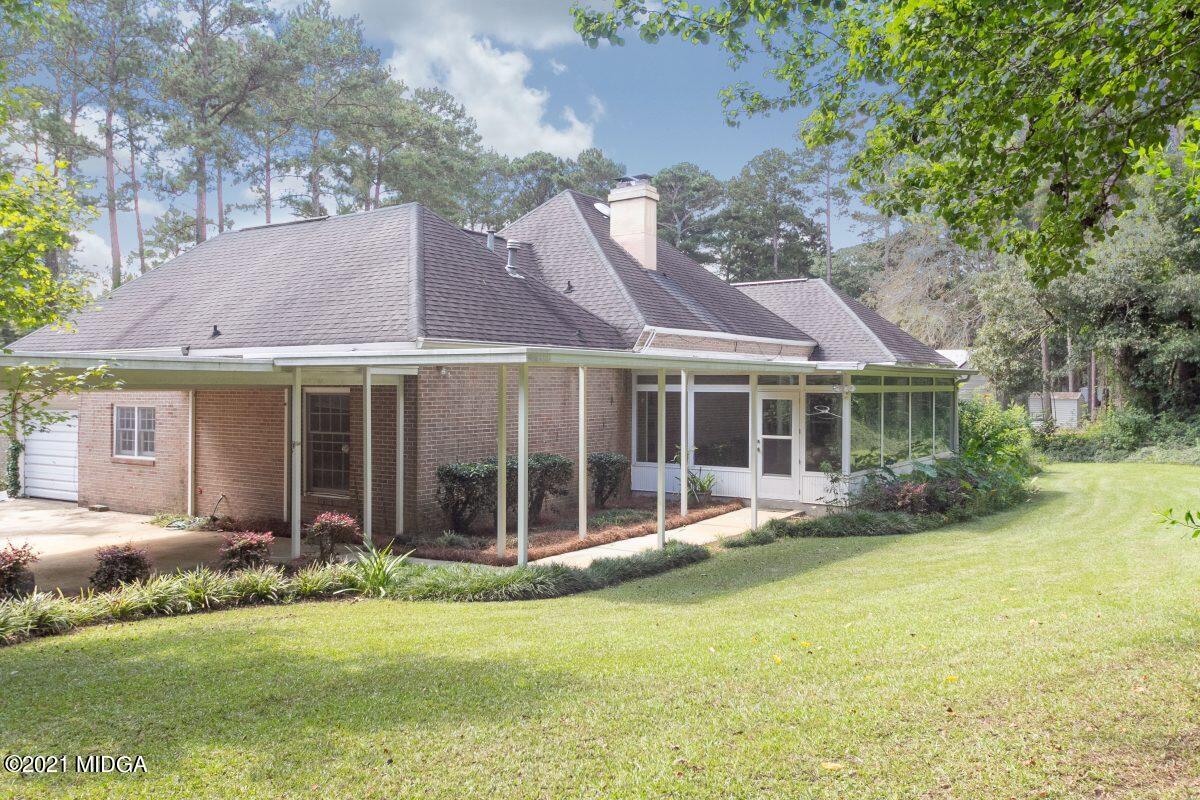 903 Tucker Road Macon, GA 31210 - Photo 30 of 31 a front view of a house with a garden and porch