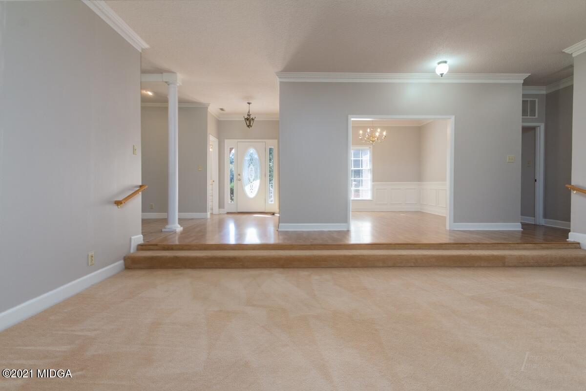 903 Tucker Road Macon, GA 31210 - Photo 5 of 31 a view of empty room with wooden floor and fan