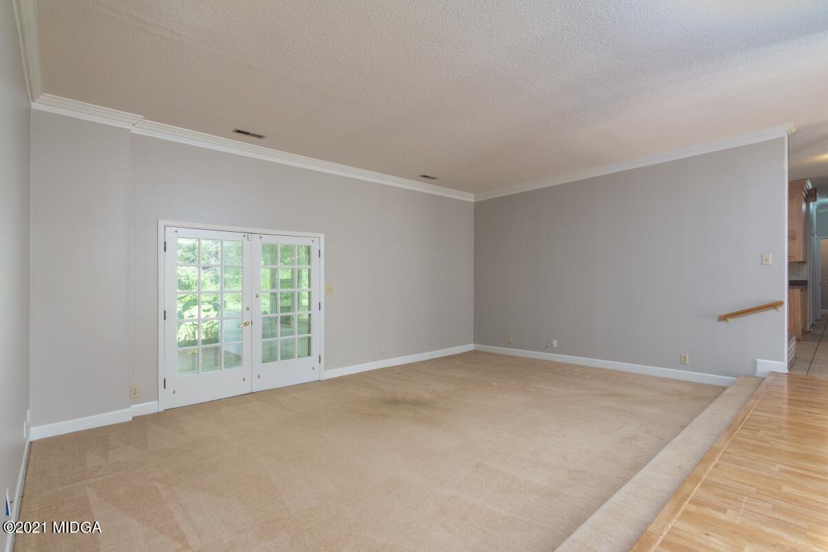 903 Tucker Road Macon, GA 31210 - Photo 7 of 31 an empty room with windows