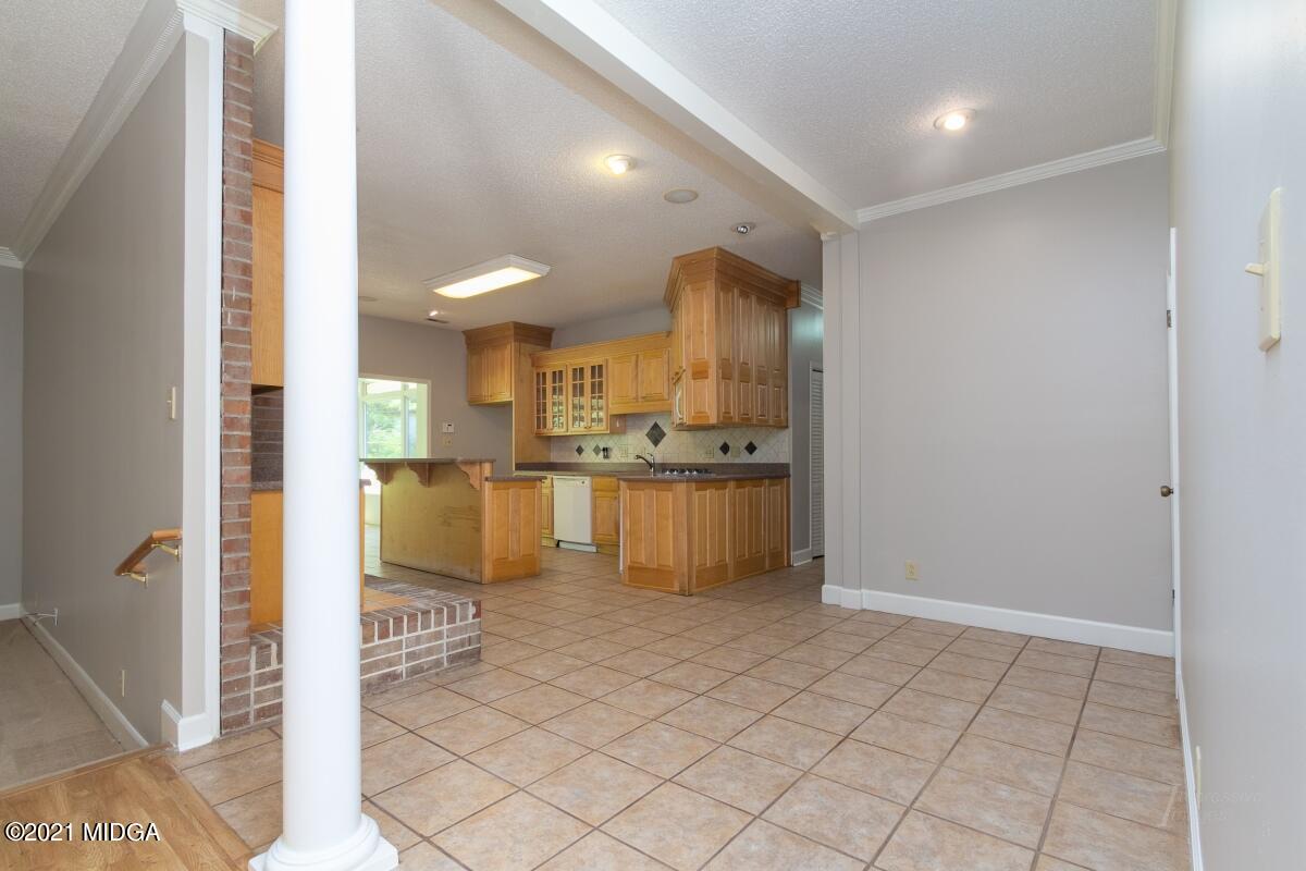 903 Tucker Road Macon, GA 31210 - Photo 8 of 31 a view of kitchen with refrigerator and cabinets