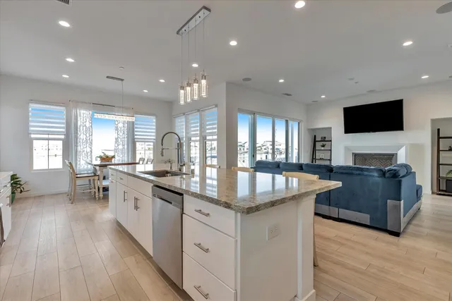a bedroom with a bed mirror and a window