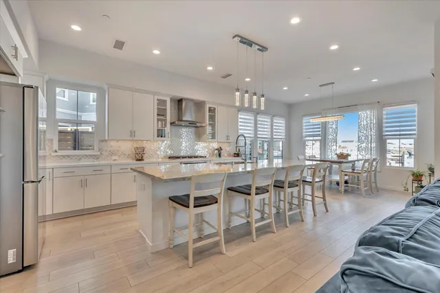 a spacious en suite bathroom with a double vanity sink and mirror