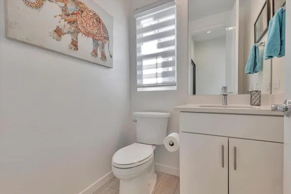 a bedroom with furniture and a flat screen tv