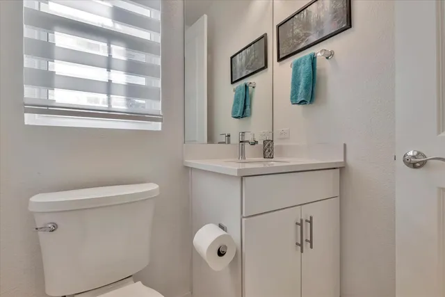 a bedroom with a bed and a chair