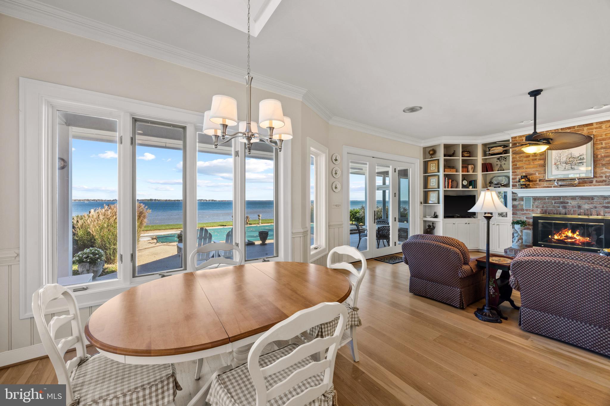 2907 Cox Neck Road East Chester, MD 21619 - Photo 13 of 43 a living room with fireplace furniture and a chandelier