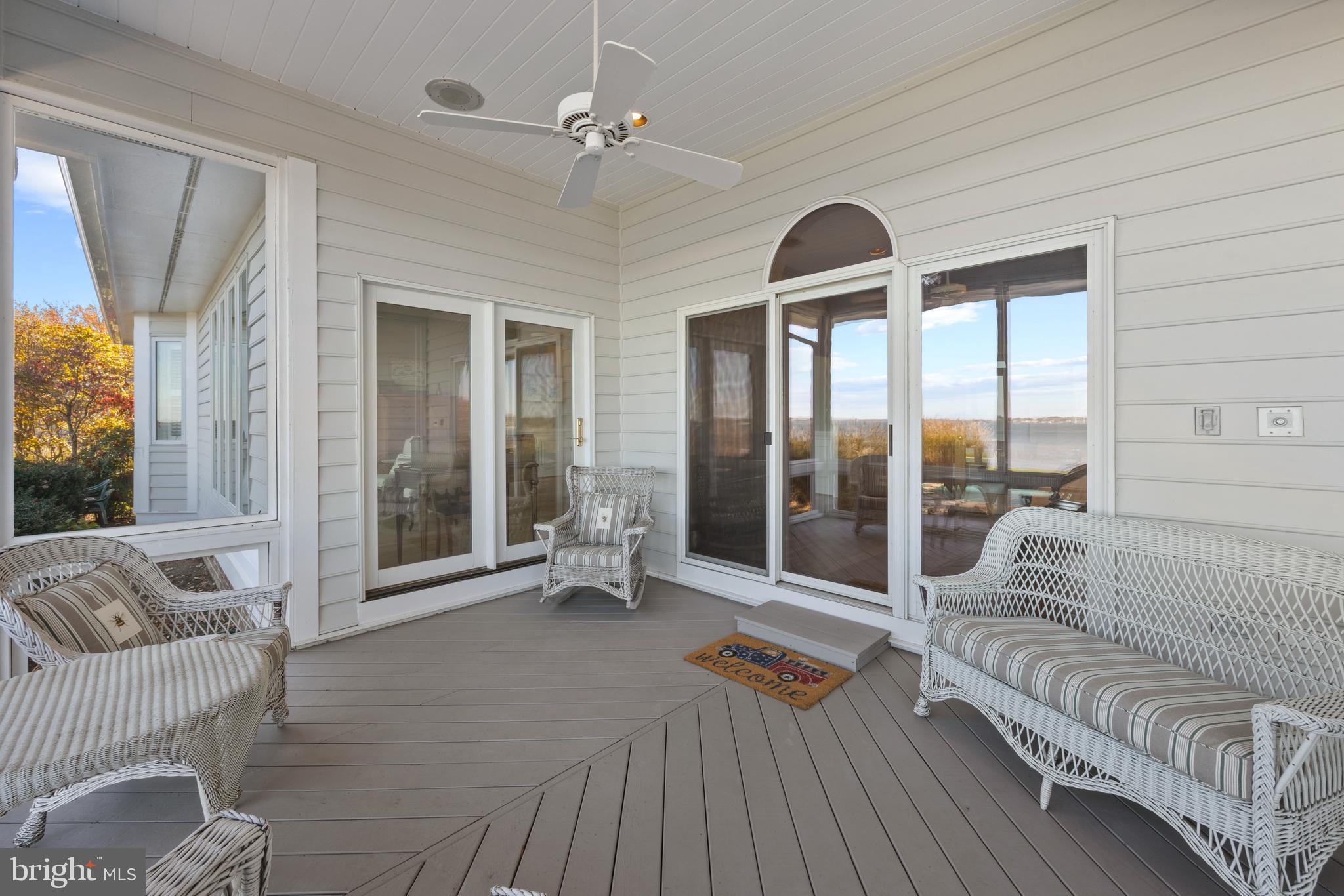 2907 Cox Neck Road East Chester, MD 21619 - Photo 18 of 43 a living room with furniture and a large window